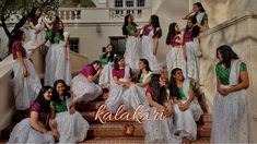 a group of women dressed in white and green outfits posing for a photo on some steps