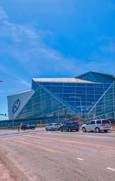 cars are parked in front of an airport terminal