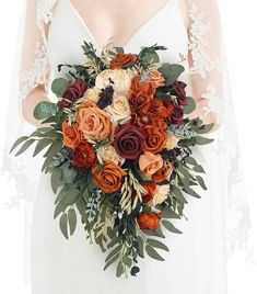 a bride holding a bouquet of flowers in her hands