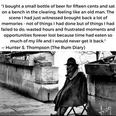 a man sitting on top of a chair next to a wall with a poem written in it