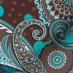 an image of a blue and brown wallpaper with paisley designs on it's side