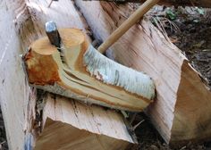 a piece of wood that has been cut and is being used to chop down trees