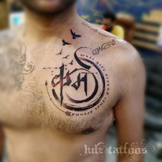 a man with a tattoo on his chest