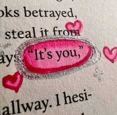 a close up of a piece of paper with words written on it and hearts in the background