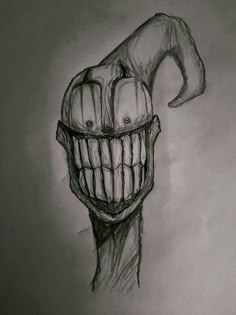 a pencil drawing of a creepy clown's face with teeth and mouth rings on his head