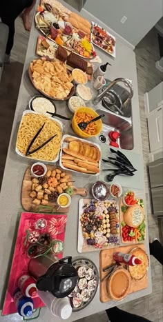 a table filled with lots of food on top of it