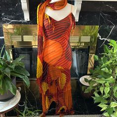 This Beautiful Dress Is Perfect For A Fall Formal. Its Colors Are Accented With Glitter Stitching. The Hem Is Scarf Like And Has A Matching Scarf. Orange Long Dress For Evening, Orange Silk Maxi Dress For Summer, Orange Evening Maxi Dress, Bohemian Yellow Evening Dresses, Fitted Multicolor Midi Dress For Festive Occasions, Orange Maxi Length Festive Dresses, Orange Maxi Dress For Festive Occasions, Orange Maxi Length Party Dress, Orange Maxi Party Dress