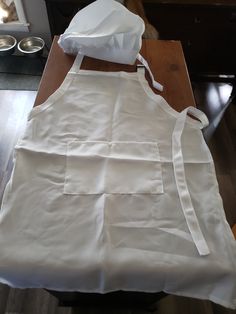 a white apron is sitting on a table