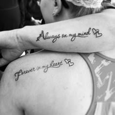 two women with tattoos on their arms that say, always my mind and forever in my heart