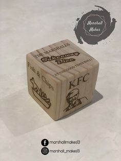 two wooden dices with different types of logos on them and the words marshall memes