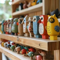 wooden toys are lined up on the shelves