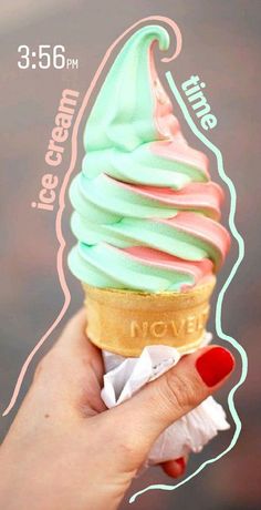 a hand holding an ice cream cone with pastel colors