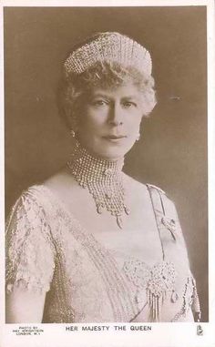 an old black and white photo of a woman wearing a tiara