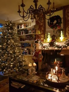 a living room with a christmas tree and fireplace