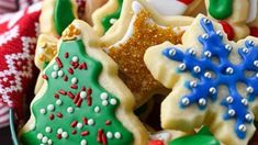 decorated christmas cookies in a bowl on a table