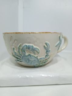 a white and blue bowl sitting on top of a table