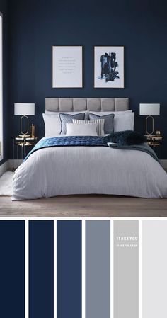 a bedroom with dark blue walls and white bedding in the center, along with two framed pictures on the wall