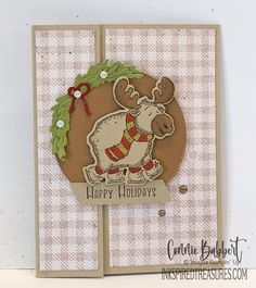 a close up of a christmas card with a moose on it and the words happy holidays