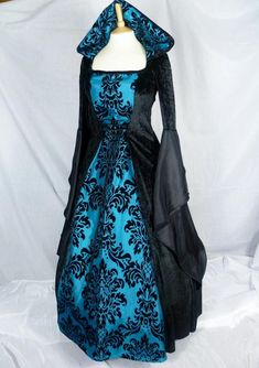 This dress will be made to the measurements you send me.Please send me your bust, waist and hip measurements and please measure from the top of your shoulder to the floor with shoes on.It will be made with beautiful jet black velvet and Teal / dark turquoise taffeta. The sleeves are part velvet and taffeta. It has a corset style front and back will lacing so you can adjust the dress to fit your body shape.Combined shipping on multiple items.If you purchase express shipping by courier please send Dark Turquoise Dress, Hooded Gown, Medieval Wedding Dress, Gothic Gowns, Fantasy Au, Medieval Wedding, Turquoise Dress, Medieval Dress, Dark Turquoise