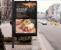 a large sign on the side of a road advertising kebab shawarma