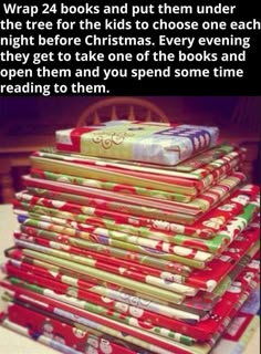 a stack of books sitting on top of each other in front of a christmas tree