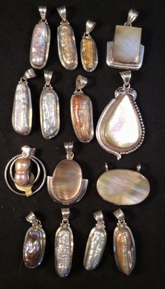 Beautiful long genuine biwa pearl or mother of pearl set in sterling silver measured without the 11mm bail request a free ribbon necklace or cord at checkout comments if you want one Open back for those that want the healing quality of the stone next to the skin. I hand pick stones from all over the world in Jaipur, India that are set in my design by a student. long pearls range from 25-37mm 2nd pic shows all together top row left sold left center sold right center right mother of pearl 33x25mm Luxury Mother Of Pearl Drop Jewelry, Luxury Mother Of Pearl Round Pendant Jewelry, Mother Of Pearl Pendant, Biwa Pearls, Ribbon Necklace, Semi Precious Jewelry, Pearl Set, My Design, Pendant Design