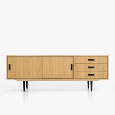 the sideboard is made from wood and has three drawers, one with black handles