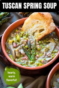 a close up of a bowl of soup with bread