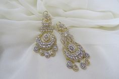 Check out this item in my Etsy shop https://www.etsy.com/listing/1203099004/gold-silver-indian-earrings-jewelry Cubic Zirconia Chandbali Wedding Jewelry, Elegant Chandelier Earrings With Stone Work, Silver Bridal Earrings With Stone Work For Reception, Elegant Dangle Chandelier Earrings With Stone Work, Elegant Stone Work Dangle Chandelier Earrings, Elegant Wedding Chandelier Earrings With Stone Work, Elegant Danglers With Stone Work For Reception, Glamorous Hand Set Dangle Bridal Earrings, Silver Chandelier Earrings For Reception