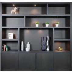 a book shelf with vases and other items on top of it in front of a white background