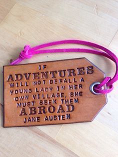 a wooden tag with an inscription on it that says if adventures will not be fail, young lady in her own village she must seek the abroad jane austen