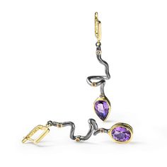 These asymmetric earrings from German Kabirski's Bacchus Bunch Collection feature one pear-cut Amethyst and one oval-cut Amethyst, plated with Black Rhodium and 18K Gold. Inspired by Bacchus, the Roman god of wine, hedonism, and artistic expression, these earrings embody the spirit of indulgence and clarity. Amethyst, often associated with Bacchus, is believed to enhance mental clarity and provide a sense of calm. These unique earrings are perfect for those who celebrate life's pleasures and seek a clear mind. Metal: 925 Silver Stones: Amethyst Plating: Black Rhodium, 18K Gold  Please Note: Natural gemstones may appear different under various lighting conditions. For the most accurate representation, refer to the model photo. The natural raw gemstones in this design may display inclusions, August Birthstone Jewelry, July Birthstone Jewelry, Fine Art Jewelry, Clear Mind, Pearl Jewellery Earrings, Jewelry Ring Box, Men's Jewelry Rings, Black Rhodium, Amethyst Earrings