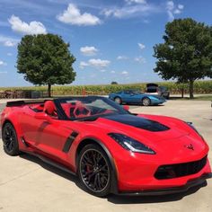 a red sports car parked in a parking lot