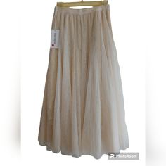 Dwirapal Pleated Skirt Size Small Off White/Tan Color/Baige New With Tag Triple Layer Pleated Sheer And Gold Blink Stretch Waist Band Not From A Smoke-Free Home Bundle For Better Prices! Spring Cream Lined Skirt, Cream Lined Maxi Skirt, Cream Lined Midi Skirt, Beige Pleated Skirt With Lined Skirt, Beige Relaxed Tiered Pleated Skirt, Beige Relaxed Pleated Tiered Skirt, Cream Midi Skirt With Lining, Cream Long Relaxed Skirt, Cream Long Flowy Skirt