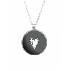 a necklace with a wolf head on it