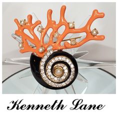 Absolutely Spectacular Vintage Kjl Jeweled Seashell Brooch! Done In A Shiny Gold-Tone With Black Enamel And Clear Crystals On The Shell Body Then There's This Fabulous Enameled Coral Branch At The Top! Whether Your A Kenneth Lane Collector Or Just Love Ocean Themed Jewelry This Is A Must Own For Your Collection! Excellent As New Condition Signed & Absolutely Authentic Kenneth Jay Lane Jewelry Vintage, Vintage Enamel Cabochon Brooches, Luxury Vintage Coral Necklace, Formal Flower-shaped Enamel Brooches, Vintage Collectible Fish-shaped Jewelry, Themed Jewelry, Black Enamel, Clear Crystal, Orange Black