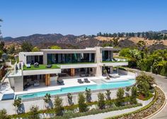 an aerial view of a house with a pool