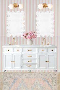 a bathroom with two sinks, mirrors and flowers in vases on the counter top