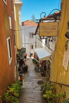 an alley way with people walking up and down it