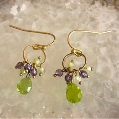 This Design Is Always One Of Our Bestselling Styles Because Of The Pretty Color Combination. This Dainty Little Dangler Is Perfect For Anyone. 1” Length Genuine Amethyst Peridot Green Crystals Handmade Fishhook Style Earrings 1e Peridot Dangle Earrings, Gold Treasure, Briolette Necklace, Wedding Earrings Studs, Black Cat Earrings, Marquise Earrings, Wedding Studs, Mickey Mouse Earrings, Betsey Johnson Earrings