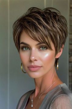 Chic layered pixie cut with volume and subtle highlights for a modern and effortless look. Pixies With Highlights, Shoulder Length Pixie Haircut, Pixie Hair With Highlights, Short Textured Haircuts For Women, Pixie Haircut Color Ideas, Pixie Cut Highlights, 2024 Pixie Cut, Pixie Cut Color Ideas, Brunette Pixie With Highlights