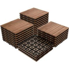 several pieces of wood sitting next to each other on top of tile flooring tiles