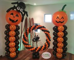 halloween decorations with pumpkins and spider balloons