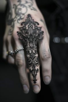 Intricate black tattoo covering the entire middle finger and part of the hand, featuring ornate designs. Hand To Forearm Tattoo, Black Work Hand Tattoo, Dark Finger Tattoos, Black Finger Tattoo, Goth Tattoo Sleeve, Cool Hand Tattoos For Men, Most Unique Tattoos, Gothic Hand Tattoo, Henna Back Tattoo