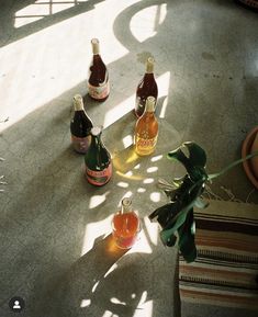 several bottles of alcohol sitting on the floor