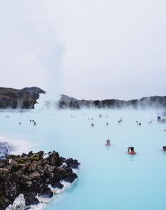 many people are swimming in the blue lagoon