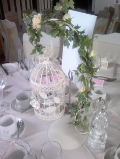 the table is set with dishes and cups