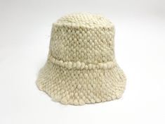 Trendy white wool bucket hat will protect your head from cold winter . The texture hat is very warm, soft and comfortable to wear. This Panama is the best fashion decision for fall-winter season in 2021-2022. SIZE: S-M (56-57) in stock M-L (58-59)Custom Made L-XL (60-61)Custom Made Custom Made design is made after a base pattern, similar to ready-to-wear. Note that it will take our team 10 - 15 days to make your product, so remember to add this to the delivery time. Made of 100% wool. Linen(Lini White Wool Casual Hat, White Wool Cap, White Knitted Wide Brim Hat, White Wool Hat With Short Brim, White Brimmed Warm Hat, White Warm Brimmed Hat, Casual Cream Cloche Hat For Winter, Cozy White Handmade Hat, White Brimmed Bucket Hat For Winter