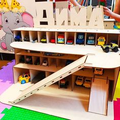 a child's play area with toys and wooden letters