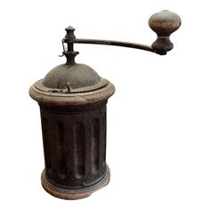 an old fashioned coffee grinder is shown against a white background with clippings